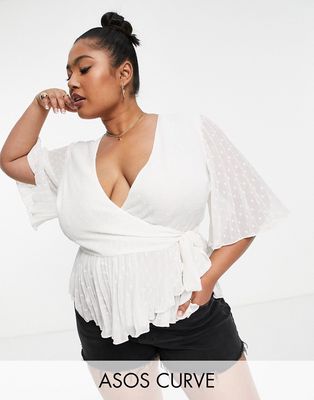 ASOS DESIGN Curve textured wrap short sleeve blouse with pleated peplum hem in ivory-White