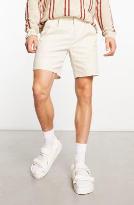 ASOS DESIGN Double Pleat Stretch Cotton Shorts in White
