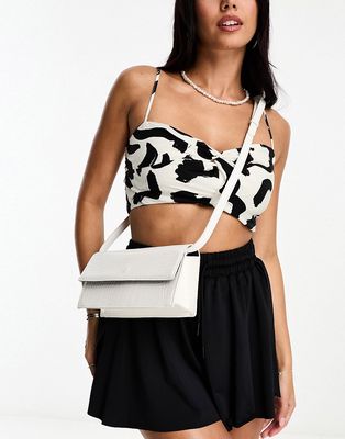 ASOS DESIGN elongated crossbody bag with detachable strap in white