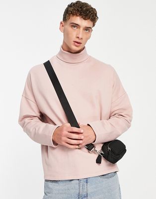 ASOS DESIGN extreme oversized turtle neck sweatshirt in pink