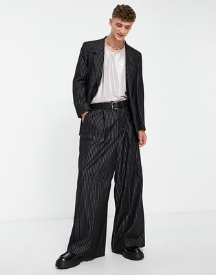 ASOS DESIGN extreme wide leg suit pants in black with gold pinstripe