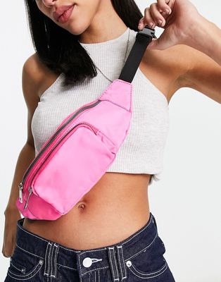 ASOS DESIGN fanny pack with front pocket in pink