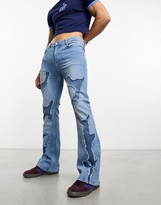 ASOS DESIGN flare jeans with raw edges in mid blue