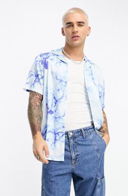 ASOS DESIGN Floral Short Sleeve Satin Button-Up Camp Shirt in Mid Blue