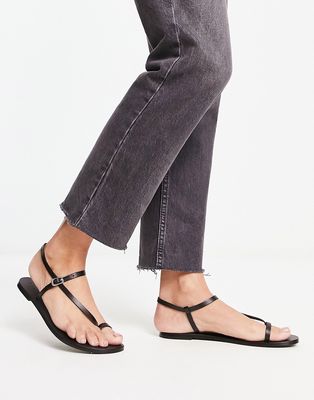 ASOS DESIGN Flutter leather toe loop flat sandal in black