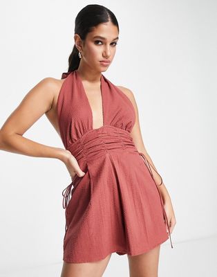 ASOS DESIGN halterneck romper with gathered waist and open back in brown