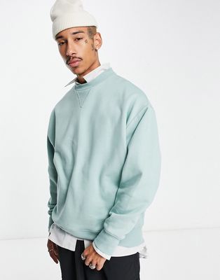 ASOS DESIGN heavyweight oversized sweatshirt in washed blue-Green