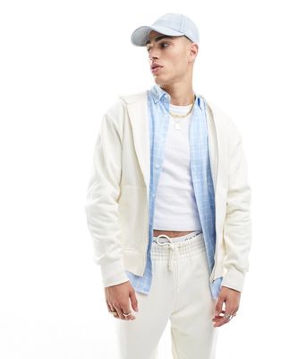 ASOS DESIGN heavyweight oversized zip through hoodie in cream-White