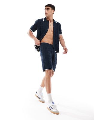 ASOS DESIGN knit spliced cable and pointelle stitch shorts with tipping in navy - part of a set