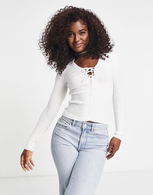 ASOS DESIGN knitted top with lace up detail in cream-White