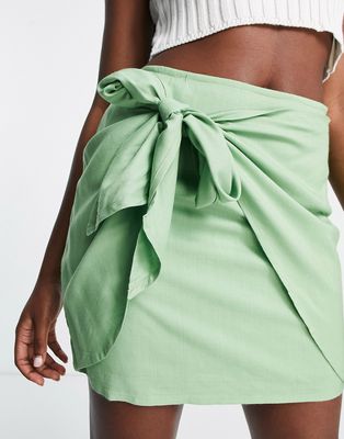 ASOS DESIGN knot wrap mini skirt in apple green