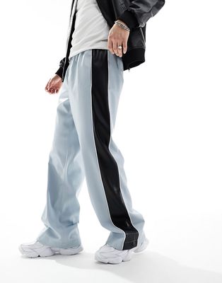 ASOS DESIGN leather look sweatpants in blue with side stripe