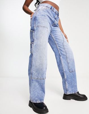 ASOS DESIGN low rise baggy boyfriend jeans with knee patches in mid blue