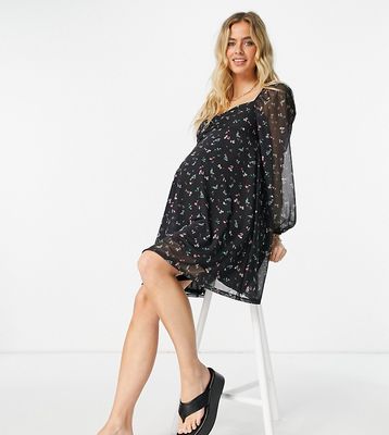 ASOS DESIGN Maternity mesh ruched front mini dress with long sleeves in black floral