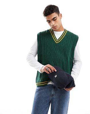 ASOS DESIGN oversized cable knit cricket tank in green & mustard tipping