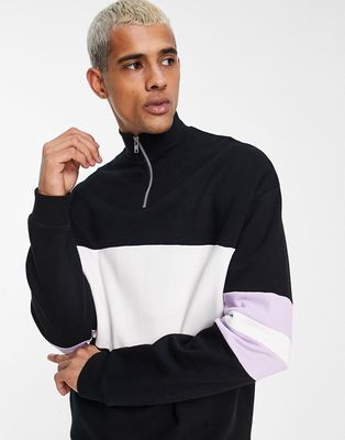 ASOS DESIGN oversized color block half zip sweatshirt in black and white-Multi