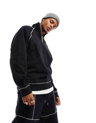 ASOS DESIGN oversized half zip sweatshirt with contrast stitching in black