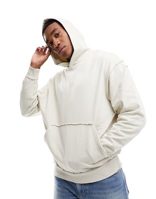 ASOS DESIGN oversized hoodie with distressing in beige-Neutral