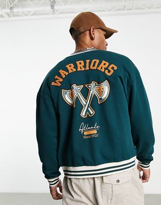 ASOS DESIGN oversized jersey track jacket in teal green with collegiate badging and boucle