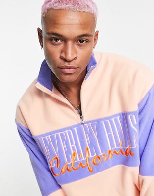 ASOS DESIGN oversized polar fleece half zip sweatshirt in pink and blue color block with city embroidery-Multi