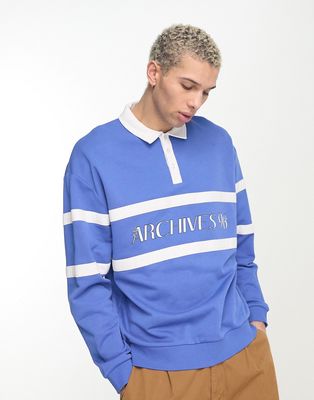 ASOS DESIGN oversized polo sweatshirt with text print in blue