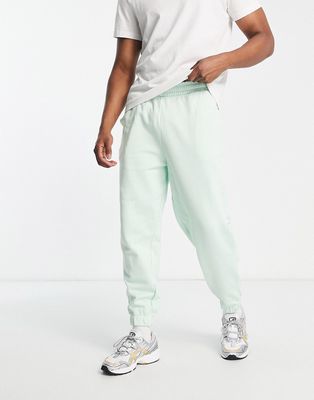 ASOS DESIGN oversized sweatpants in pastel green
