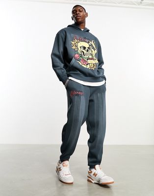 ASOS DESIGN oversized sweatpants in washed charcoal with grunge text print - part of a set-Gray