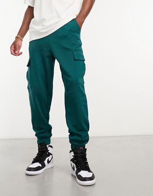 ASOS DESIGN oversized sweatpants with cargo pocket in teal green