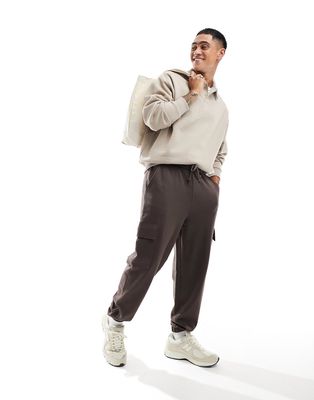ASOS DESIGN oversized sweatpants with cargo pockets in brown