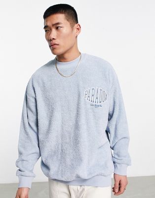 ASOS DESIGN oversized sweatshirt in blue towelling with chest embrodiery