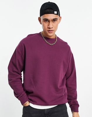 ASOS DESIGN oversized sweatshirt in burgundy-Red