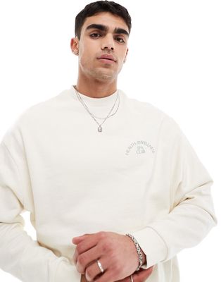 ASOS DESIGN oversized sweatshirt in off white with sport print