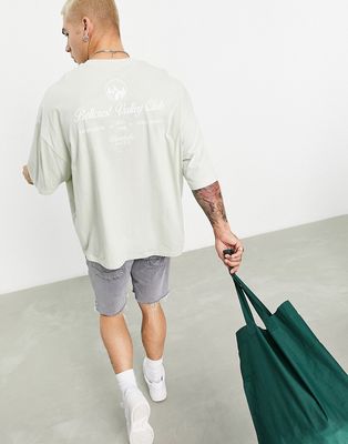 ASOS DESIGN oversized t-shirt in light green with bellcrest club back print