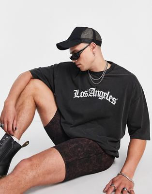 ASOS DESIGN oversized T-shirt in washed black with LA front print