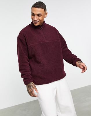ASOS DESIGN oversized teddy fleece half zip sweatshirt in burgundy-Pink