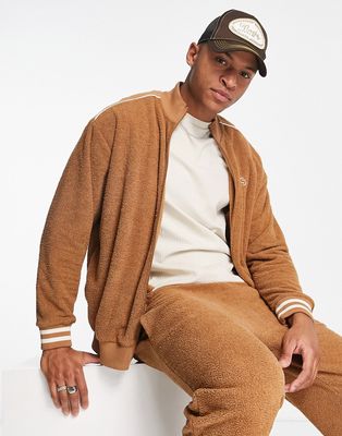 ASOS DESIGN oversized track jacket in brown towelling with panel detail - part of a set
