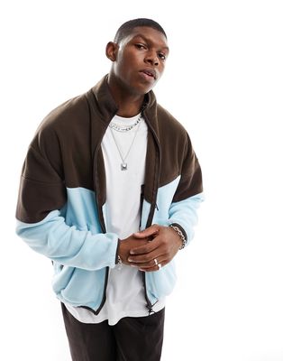 ASOS DESIGN oversized zip up track jacket in blue polar fleece with brown color blocking