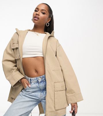 ASOS DESIGN Petite oversized washed parka with cargo pockets in sand-Green