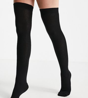 ASOS DESIGN Petite thigh high socks in black