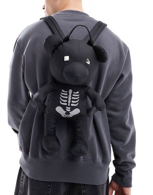 ASOS DESIGN reflective skeleton teddy backpack in black