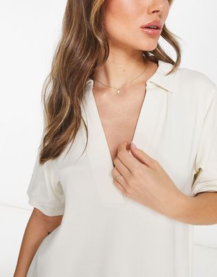 ASOS DESIGN relaxed polo shirt with deep v in sand-Neutral