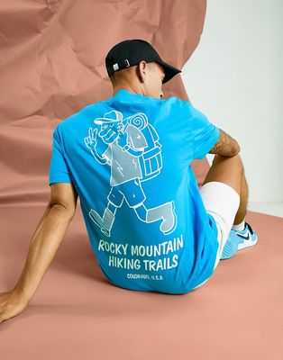 ASOS DESIGN relaxed t-shirt in blue with cartoon hiker front & back print