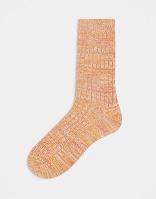 ASOS DESIGN ribbed twist socks in light orange