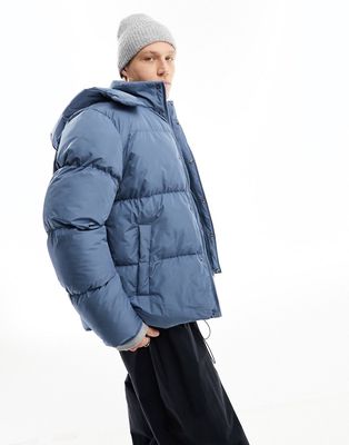 ASOS DESIGN shower resistant puffer jacket with detachable hood in blue