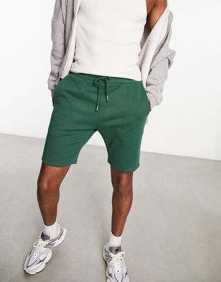 ASOS DESIGN skinny jersey shorts in forest green