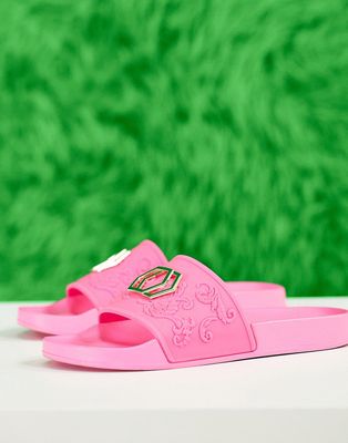 ASOS DESIGN sliders in pink with gold badge