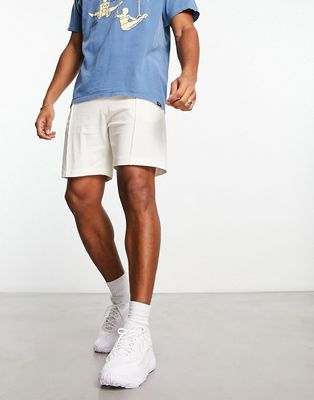 ASOS DESIGN slim shorts in beige pique-Neutral