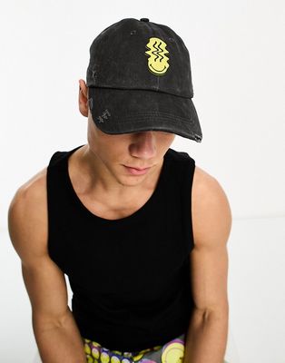 ASOS DESIGN Smiley Collab soft baseball cap with rubberized logo in distressed black
