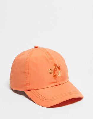 ASOS DESIGN soft baseball cap with hibiscus embroidery in orange