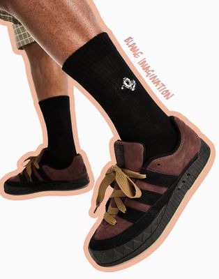 ASOS DESIGN sports socks in black with donut embroidery